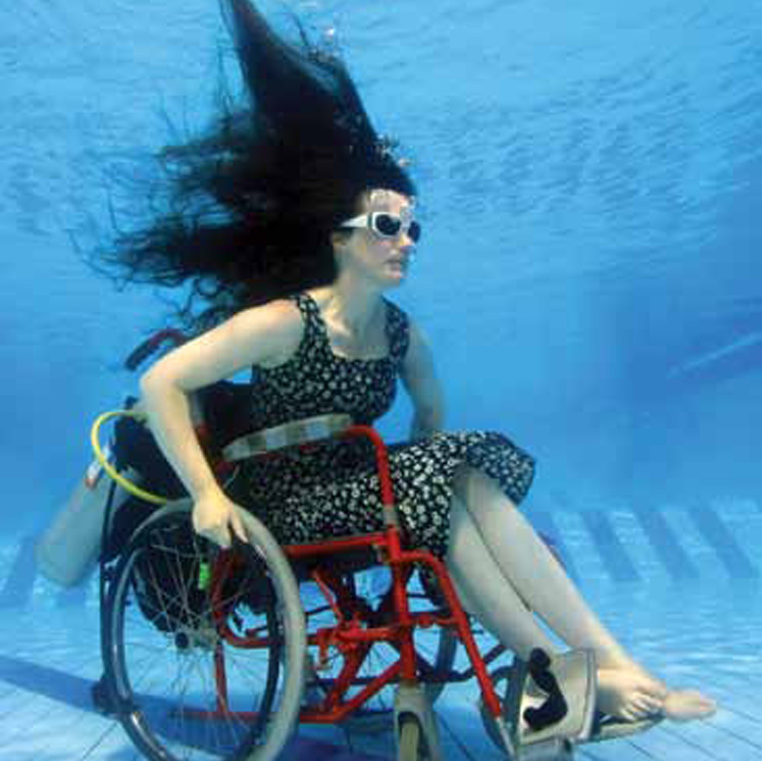 Woman in wheelchair under water 