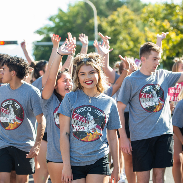 Students at NMSU Homecoming Parade